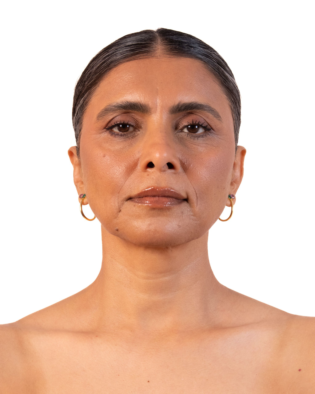 Gold duo hoop earrings by MAISON MEGH, featuring sleek, layered design with shiny finish, displayed on a white background.