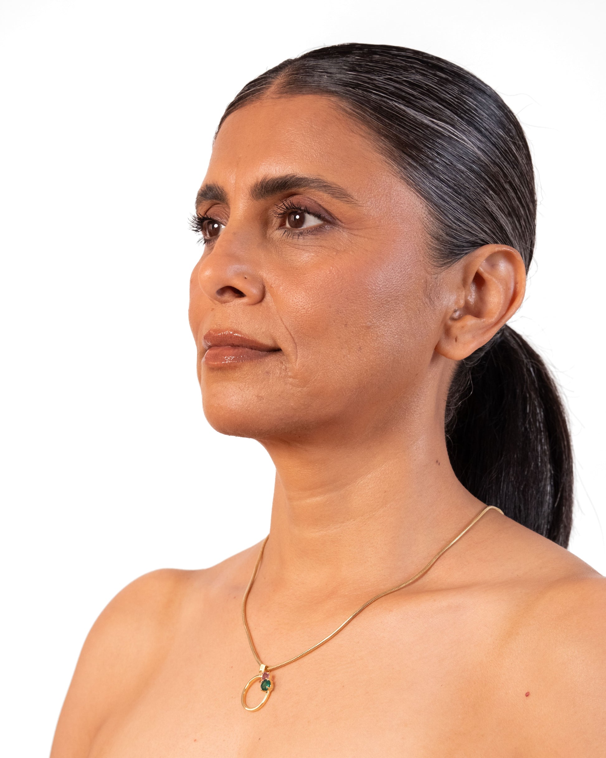 Gold MTW Duo Pendant by MAISON MEGH featuring two interconnected circular pendants on a sleek chain.