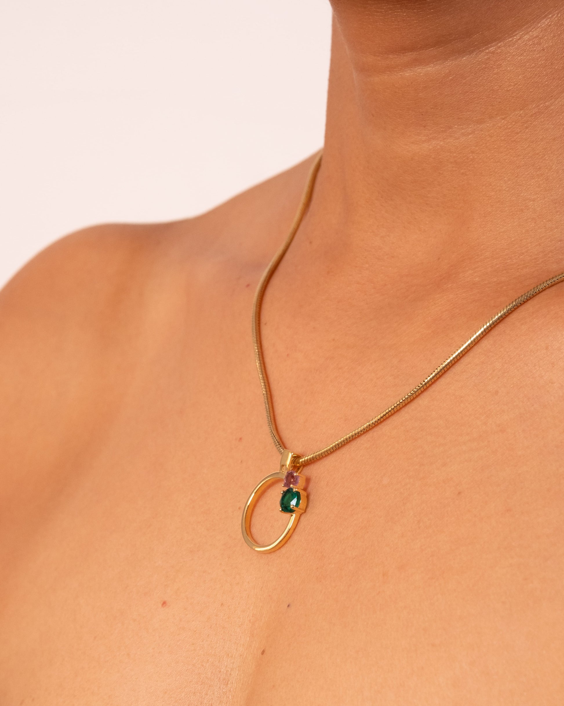 Gold MTW Duo Pendant by MAISON MEGH featuring layered circular design on a delicate chain.