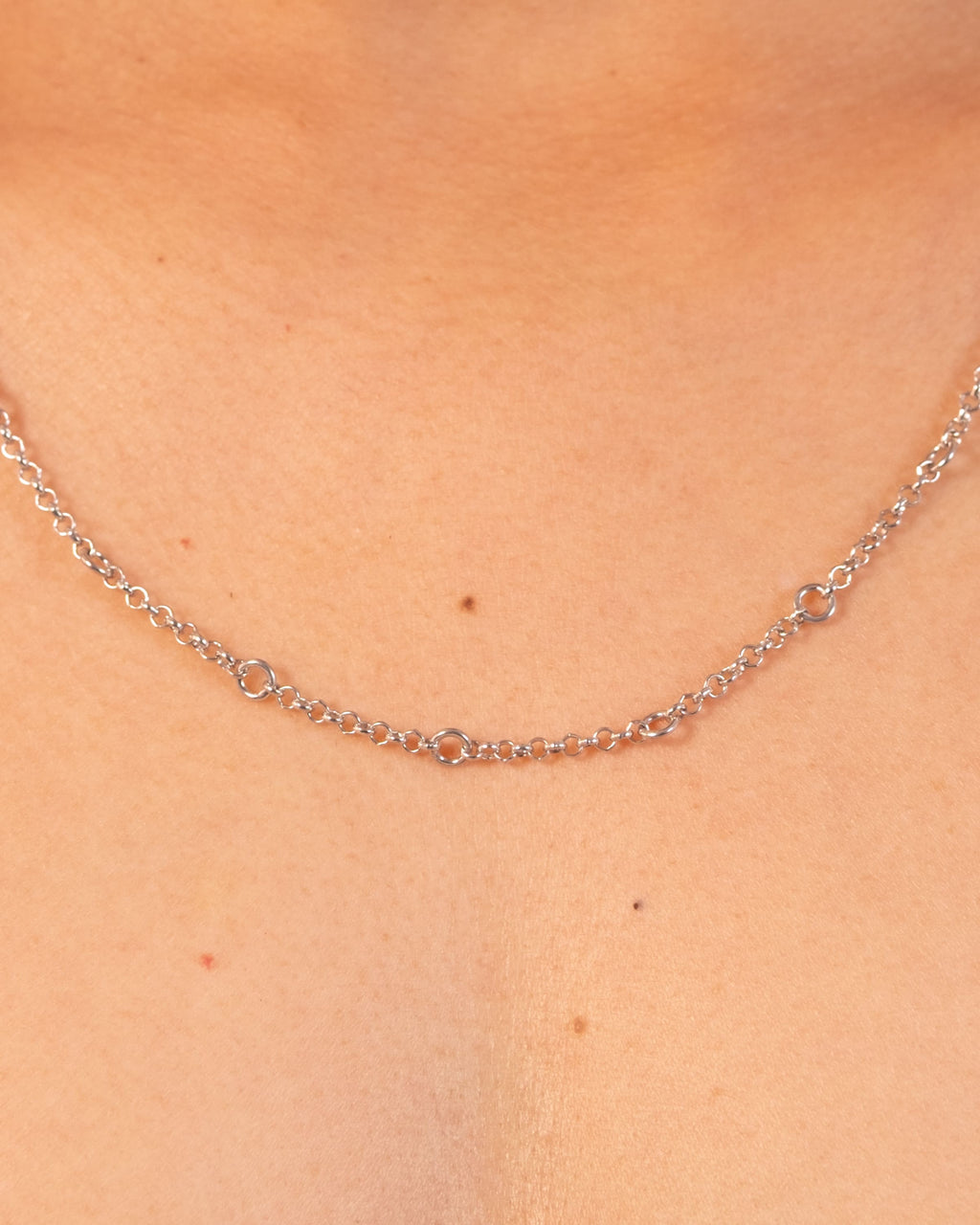 Silver Tiny Linky Chain Circle by MAISON MEGH showing close-up of delicate circular chain links.