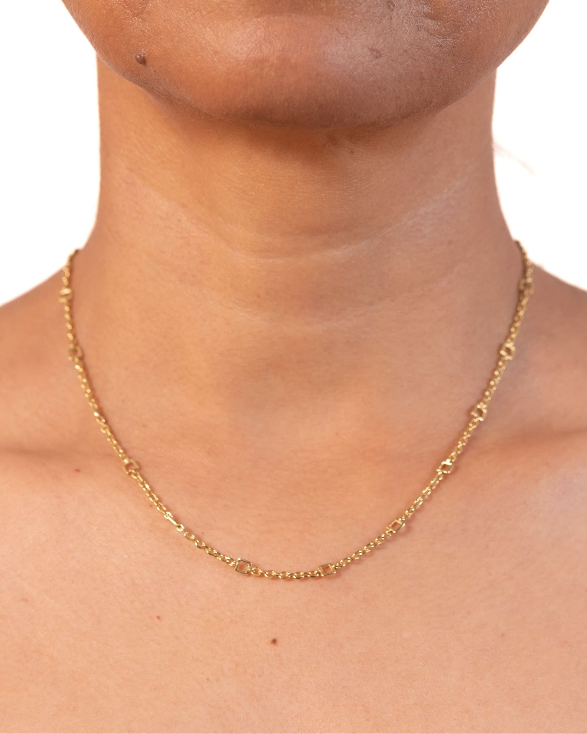 Gold Tiny Linky Chain Square by MAISON MEGH featuring small square links on a delicate chain.