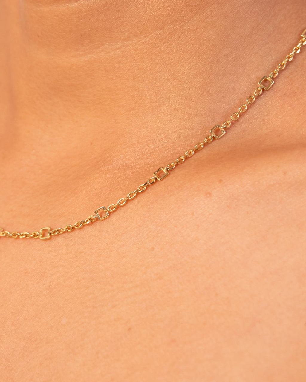 Gold Tiny Linky Chain Square by MAISON MEGH featuring small square links on a delicate chain.
